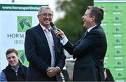 14 September 2022; Ireland team manager Michael Blake, left, is interviewed by MC Brendan McArdle as The Aga Khan trophy is brought to Tuamgraney, Clare, following Ireland's victory in the Longines FEI Jumping Nations Cup at the Dublin Horse Show. Photo by Sam Barnes/Sportsfile