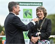 14 September 2022; Mayor of Tuamgraney Mary Coffey is interviewed by MC Brendan McArdle as the The Aga Khan trophy is brought to Tuamgraney, Clare, following Ireland's victory in the Longines FEI Jumping Nations Cup at the Dublin Horse Show. Photo by Sam Barnes/Sportsfile