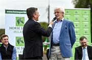 14 September 2022; Jerry Sweetnam, father of Team Ireland rider Shane Sweetnam, right, is interviewed by MC Brendan McArdle as The Aga Khan trophy is brought to Tuamgraney, Clare, following Ireland's victory in the Longines FEI Jumping Nations Cup at the Dublin Horse Show. Photo by Sam Barnes/Sportsfile
