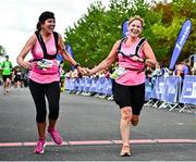 17 September 2022; Collette Sutton, left, and Orla Wilson cross the finish line at the Irish Life Dublin Half Marathon on Saturday 17th of September in the Phoenix Park, Dublin. Photo by Sam Barnes/Sportsfile