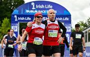 17 September 2022; Runners embrace after finishing the Irish Life Dublin Half Marathon on Saturday 17th of September in the Phoenix Park, Dublin. Photo by Sam Barnes/Sportsfile