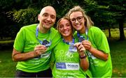 17 September 2022; Participants, from left, Donail McQuillan from Drumgoon, Cavan, Shauna McAlary from Ballymina, Antrim, and Stephanie O’Kane from Feeny, Derry, with their finisher medals after the Irish Life Dublin Half Marathon on Saturday 17th of September in the Phoenix Park, Dublin. Photo by Sam Barnes/Sportsfile