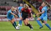 17 September 2022; Bohemians captain Erica Burke in action against Fiona Donnelly, right, and Lynn Craven of DLR Waves during the SSE Airtricity Women's National League match between Bohemians and DLR Waves at Dalymount Park in Dublin. Photo by Tyler Miller/Sportsfile