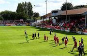 18 September 2022; Players and officials make their way onto the pitch before the Extra.ie FAI Cup Quarter-Final match between Shelbourne and Bohemians at Tolka Park in Dublin. Photo by Seb Daly/Sportsfile