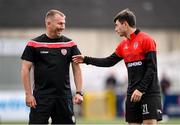 18 September 2022; Derry City assistant manager Alan Reynolds speaks with Declan Glass of Derry City before the Extra.ie FAI Cup Quarter-Final match between Derry City and Shamrock Rovers at The Ryan McBride Brandywell Stadium in Derry. Photo by Stephen McCarthy/Sportsfile