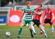 18 September 2022; Rory Gaffney of Shamrock Rovers in action against Cameron Dummigan of Derry City during the Extra.ie FAI Cup Quarter-Final match between Derry City and Shamrock Rovers at The Ryan McBride Brandywell Stadium in Derry. Photo by Stephen McCarthy/Sportsfile