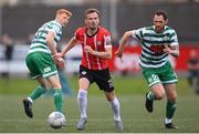 18 September 2022; Cameron Dummigan of Derry City in action against Chris McCann of Shamrock Rovers during the Extra.ie FAI Cup Quarter-Final match between Derry City and Shamrock Rovers at The Ryan McBride Brandywell Stadium in Derry. Photo by Stephen McCarthy/Sportsfile