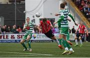 18 September 2022; Joe Thomson of Derry City heads a shot on goal despite the attention of Sean Kavanagh of Shamrock Rovers during the Extra.ie FAI Cup Quarter-Final match between Derry City and Shamrock Rovers at The Ryan McBride Brandywell Stadium in Derry. Photo by Stephen McCarthy/Sportsfile