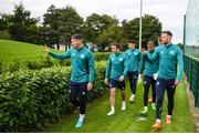19 September 2022; Republic of Ireland players including Matt Doherty, left, and Shane Duffy, right, wave to school children before a Republic of Ireland training session at the FAI National Training Centre in Abbotstown, Dublin. Photo by Stephen McCarthy/Sportsfile