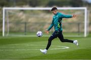 19 September 2022; John Egan practices his GAA skills during a Republic of Ireland training session at the FAI National Training Centre in Abbotstown, Dublin. Photo by Stephen McCarthy/Sportsfile