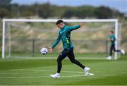 19 September 2022; John Egan practices his GAA skills during a Republic of Ireland training session at the FAI National Training Centre in Abbotstown, Dublin. Photo by Stephen McCarthy/Sportsfile