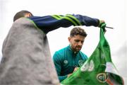 19 September 2022; Robbie Brady signs autographs for pupils from Latnamard National School, Monaghan, after a Republic of Ireland training session at the FAI National Training Centre in Abbotstown, Dublin. Photo by Stephen McCarthy/Sportsfile