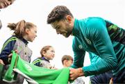 19 September 2022; Robbie Brady signs autographs for pupils from Latnamard National School, Monaghan, after a Republic of Ireland training session at the FAI National Training Centre in Abbotstown, Dublin. Photo by Stephen McCarthy/Sportsfile
