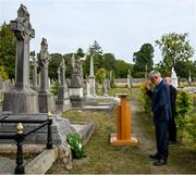 20 September 2022; Uachtarán Chumann Lúthchleas Gael Larry McCarthy, in the company of Monsignor Eoin Thynne, after placing a wreath on the grave of Michael Cusack at Glasnevin cemetery in Dublin, in a ceremony marking the 175th anniversary of the birth of the Clare school teacher who played a pivotal role in the formation of the GAA in 1884. Photo by Brendan Moran/Sportsfile