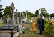 20 September 2022; Uachtarán Chumann Lúthchleas Gael Larry McCarthy, in the company of Monsignor Eoin Thynne, after placing a wreath on the grave of Michael Cusack at Glasnevin cemetery in Dublin, in a ceremony marking the 175th anniversary of the birth of the Clare school teacher who played a pivotal role in the formation of the GAA in 1884. Photo by Brendan Moran/Sportsfile