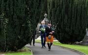 20 September 2022; Led by piper Michael Maher of the Irish United Nations Veterans Pipe Band Association, leads Uachtarán Chumann Lúthchleas Gael Larry McCarthy and members of the GAA on their way to place a wreath on the grave of Michael Cusack at Glasnevin cemetery in Dublin in a ceremony marking the 175th anniversary of the birth of the Clare school teacher who played a pivotal role in the formation of the GAA in 1884. Photo by Brendan Moran/Sportsfile