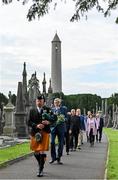 20 September 2022; Led by piper Michael Maher of the Irish United Nations Veterans Pipe Band Association, leads Uachtarán Chumann Lúthchleas Gael Larry McCarthy and members of the GAA on their way to place a wreath on the grave of Michael Cusack at Glasnevin cemetery in Dublin in a ceremony marking the 175th anniversary of the birth of the Clare school teacher who played a pivotal role in the formation of the GAA in 1884. Photo by Brendan Moran/Sportsfile