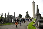 20 September 2022; Led by piper Michael Maher of the Irish United Nations Veterans Pipe Band Association, leads Uachtarán Chumann Lúthchleas Gael Larry McCarthy and members of the GAA on their way to place a wreath on the grave of Michael Cusack at Glasnevin cemetery in Dublin in a ceremony marking the 175th anniversary of the birth of the Clare school teacher who played a pivotal role in the formation of the GAA in 1884. Photo by Brendan Moran/Sportsfile