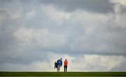 22 September 2022; Leona Maguire of Ireland and her caddie Dermot Byrne stand on the sixth fairway during round one of the KPMG Women's Irish Open Golf Championship at Dromoland Castle in Clare. Photo by Brendan Moran/Sportsfile