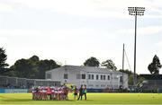 17 September 2022; Whitehall Colmcille players and staff huddle before the Dublin County Senior Club Football Championship Quarter-Final match between Na Fianna and Whitehall Colmcille at Parnell Park in Dublin. Photo by Ben McShane/Sportsfile