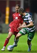 22 September 2022; John Ross Wilson of Shelbourne in action against Neil Farrugia of Shamrock Rovers during the SSE Airtricity League Premier Division match between Shelbourne and Shamrock Rovers at Tolka Park in Dublin. Photo by Sam Barnes/Sportsfile
