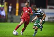22 September 2022; John Ross Wilson of Shelbourne in action against Neil Farrugia of Shamrock Rovers during the SSE Airtricity League Premier Division match between Shelbourne and Shamrock Rovers at Tolka Park in Dublin. Photo by Sam Barnes/Sportsfile