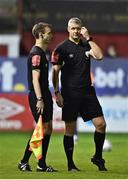 22 September 2022; Referee Ben Connolly, right, and linesman Christopher Campbell during a break in play after a missle was thrown during the SSE Airtricity League Premier Division match between Shelbourne and Shamrock Rovers at Tolka Park in Dublin. Photo by Sam Barnes/Sportsfile