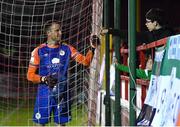 22 September 2022; Shelbourne goalkeeper Brendan Clarke bumps fists with a young Shamrock Rovers supporter during the SSE Airtricity League Premier Division match between Shelbourne and Shamrock Rovers at Tolka Park in Dublin. Photo by Sam Barnes/Sportsfile