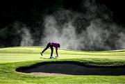 23 September 2022; Leona Maguire of Ireland marks her ball on the 15th green as steam fog rises off the river Rine during round two of the KPMG Women's Irish Open Golf Championship at Dromoland Castle in Clare. Photo by Brendan Moran/Sportsfile