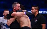 23 September 2022; Luca Poclit celebrates with SBG coach John Kavanagh, after defeating Dante  Schiro by TKO during their welterweight bout during Bellator 285 at 3 Arena in Dublin. Photo by Sam Barnes/Sportsfile