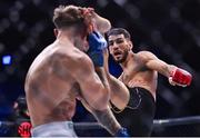 23 September 2022; Asael Adjoudj knocks down Jordan Barton during their featherweight bout during Bellator 285 at 3 Arena in Dublin. Photo by Sam Barnes/Sportsfile