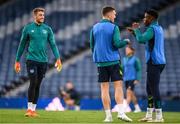 23 September 2022; Goalkeeper Mark Travers with Chiedozie Ogbene, right, and Dara O'Shea, centre, during a Republic of Ireland training session at Hampden Park in Glasgow, Scotland. Photo by Stephen McCarthy/Sportsfile