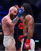 23 September 2022;  Peter Queally, left, congratulated Benson Henderson after their lightweight bout during Bellator 285 at 3 Arena in Dublin. Photo by Sam Barnes/Sportsfile
