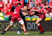 24 September 2022; Michael Lowry of Ulster is tackled by Vaea Fifita and Jonathan Davies of Scarlets during the United Rugby Championship match between Scarlets and Ulster at Parc Y Scarlets in Llanelli, Wales. Photo by Chris Fairweather/Sportsfile