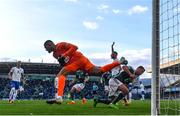 24 September 2022; Kosovo goalkeeper Arijanet Muric makes a save despite the tackle of Dion Charles of Northern Ireland during the UEFA Nations League C Group 2 match between Northern Ireland and Kosovo at National Stadium at Windsor Park in Belfast. Photo by Ramsey Cardy/Sportsfile