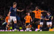 24 September 2022; Michael Obafemi of Republic of Ireland and Jack Hendry of Scotland during UEFA Nations League B Group 1 match between Scotland and Republic of Ireland at Hampden Park in Glasgow, Scotland. Photo by Stephen McCarthy/Sportsfile