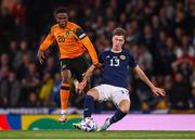 24 September 2022; Jack Hendry of Scotland in action against Chiedozie Ogbene of Republic of Ireland during UEFA Nations League B Group 1 match between Scotland and Republic of Ireland at Hampden Park in Glasgow, Scotland. Photo by Stephen McCarthy/Sportsfile