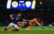 24 September 2022; Chiedozie Ogbene of Republic of Ireland is fouled by Scott McKenna of Scotland during UEFA Nations League B Group 1 match between Scotland and Republic of Ireland at Hampden Park in Glasgow, Scotland. Photo by Stephen McCarthy/Sportsfile