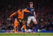 24 September 2022; Chiedozie Ogbene of Republic of Ireland in action against Jack Hendry of Scotland during UEFA Nations League B Group 1 match between Scotland and Republic of Ireland at Hampden Park in Glasgow, Scotland. Photo by Stephen McCarthy/Sportsfile