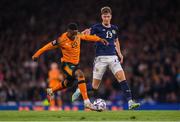 24 September 2022; Chiedozie Ogbene of Republic of Ireland in action against Jack Hendry of Scotland during UEFA Nations League B Group 1 match between Scotland and Republic of Ireland at Hampden Park in Glasgow, Scotland. Photo by Stephen McCarthy/Sportsfile