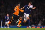 24 September 2022; Chiedozie Ogbene of Republic of Ireland in action against Jack Hendry of Scotland during UEFA Nations League B Group 1 match between Scotland and Republic of Ireland at Hampden Park in Glasgow, Scotland. Photo by Stephen McCarthy/Sportsfile