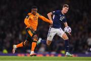 24 September 2022; Chiedozie Ogbene of Republic of Ireland in action against Jack Hendry of Scotland during UEFA Nations League B Group 1 match between Scotland and Republic of Ireland at Hampden Park in Glasgow, Scotland. Photo by Stephen McCarthy/Sportsfile