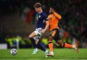 24 September 2022; Jack Hendry of Scotland in action against Chiedozie Ogbene of Republic of Ireland during UEFA Nations League B Group 1 match between Scotland and Republic of Ireland at Hampden Park in Glasgow, Scotland. Photo by Eóin Noonan/Sportsfile