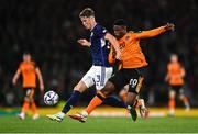 24 September 2022; Jack Hendry of Scotland and Chiedozie Ogbene of Republic of Ireland during UEFA Nations League B Group 1 match between Scotland and Republic of Ireland at Hampden Park in Glasgow, Scotland. Photo by Eóin Noonan/Sportsfile