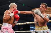 24 September 2022; Eric Donovan, right, and, and Khalil El Hadri during their EBU European Union super-featherweight bout at the Europa Hotel in Belfast. Photo by Ramsey Cardy/Sportsfile