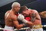 24 September 2022; Eric Donovan, right, and, and Khalil El Hadri during their EBU European Union super-featherweight bout at the Europa Hotel in Belfast. Photo by Ramsey Cardy/Sportsfile