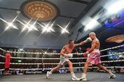 24 September 2022; (EDITOR'S NOTE; This image was created using a special effects camera filter) Eric Donovan, left, and, and Khalil El Hadri during their EBU European Union super-featherweight bout at the Europa Hotel in Belfast. Photo by Ramsey Cardy/Sportsfile