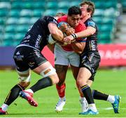 25 September 2022; Malakai Fekitoa of Munster is tackled by Will Rowlands, left, and Rhodri Williams of Dragons during the United Rugby Championship match between Dragons and Munster at Rodney Parade in Newport, Wales. Photo by Mark Lewis/Sportsfile