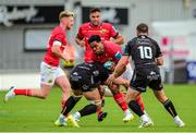 25 September 2022; Malakai Fekitoa of Munster is tackled by Taine Basham of Dragons during the United Rugby Championship match between Dragons and Munster at Rodney Parade in Newport, Wales. Photo by Mark Lewis/Sportsfile