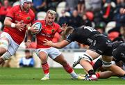 25 September 2022; Craig Casey of Munster is tackled by Ben Carter of Dragons during the United Rugby Championship match between Dragons and Munster at Rodney Parade in Newport, Wales. Photo by Ben Evans/Sportsfile